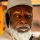 Elderly man with white beard and cap