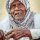 an old woman is holding a stick in her hand